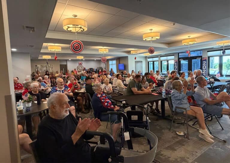 Residents and guests gather for the America 250 celebration at Villas at Stoney Point, enjoying a patriotic community program.